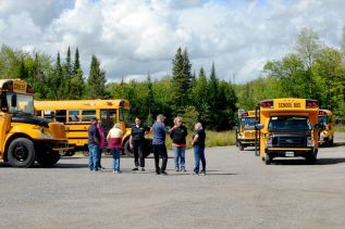 Dunham Bus Services driveers after the morning run during the first week of school at Granite Ridge Education Centre in Sharbot Lake, gathering at the Sharbot Lake PetroCan for a socially distanced chat.
